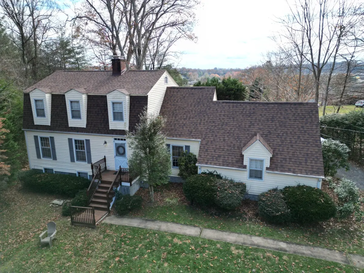 Roof repair scoping with itemized estimate paperwork.