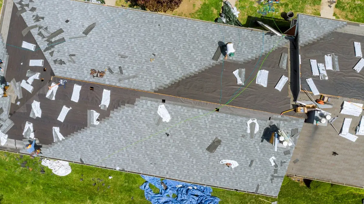 A Palisade Roofing crew installing architectural shingles on a residential home in the Tri-Cities.