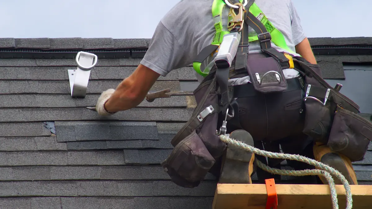 Flashing and shingle repair at a Tri-Cities residential roof.