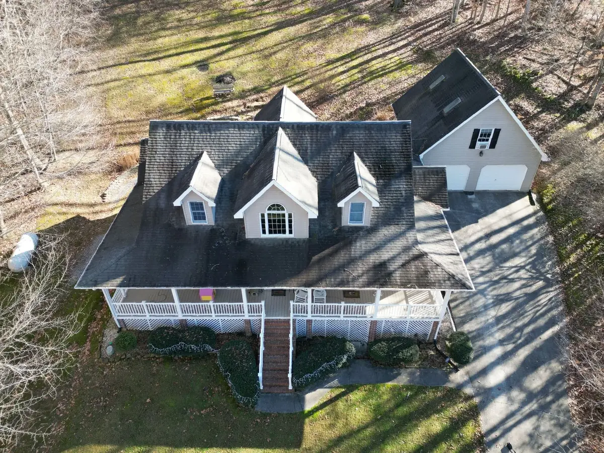 Drone aerial of a King Valley Estates home in Kingsport, Tennessee, with a recently installed Palisade Roofing project visible.