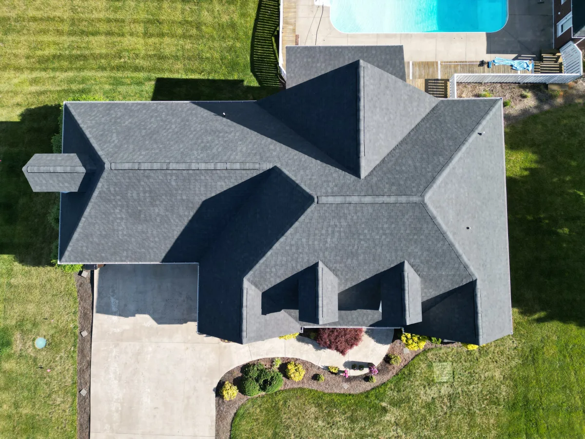 Pewter gray architectural shingles seen from above on a complex hip roof — completed by Palisade Roofing in the Tri-Cities.